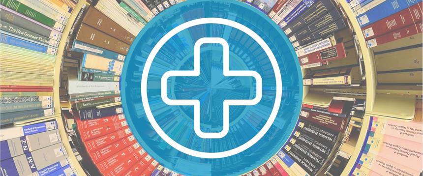 Photo of books with medical cross icon in center