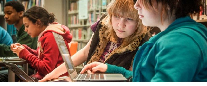 Teens using computer in Teen Underground at Loussac Library