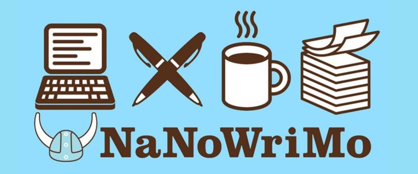 NaNoWriMo: picture of computer, pens, mug, papers and viking helmet
