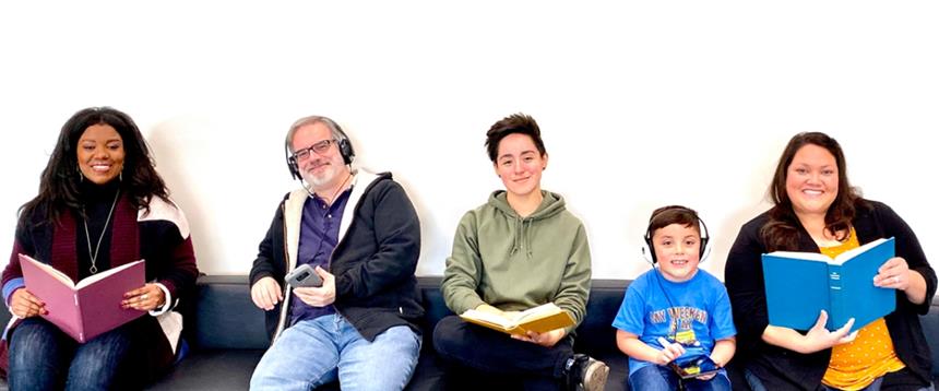 Photo of adults, teen, and child hold books or listening to audio books.