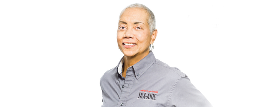 Woman wearing AARP Tax-aide shirt