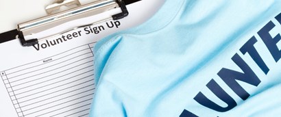 Clipboard with Volunteer Sign Up sheet and t-shirt printed with Volunteer
