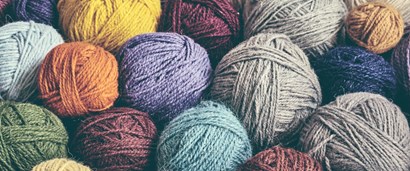 Colorful balls of yarn in a stack