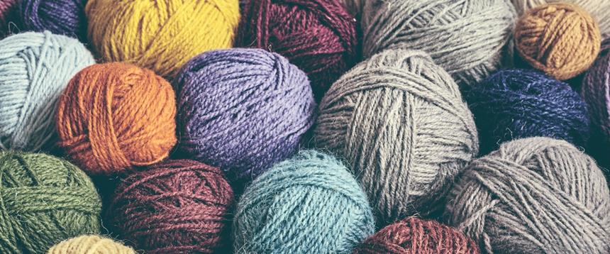 Colorful balls of yarn in a stack